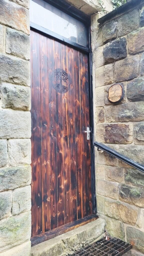 Rustic entrance to The Elderwood Project workshop in Menston